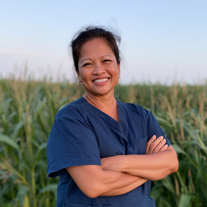 Portrait of a care coordinator in navy scrubs